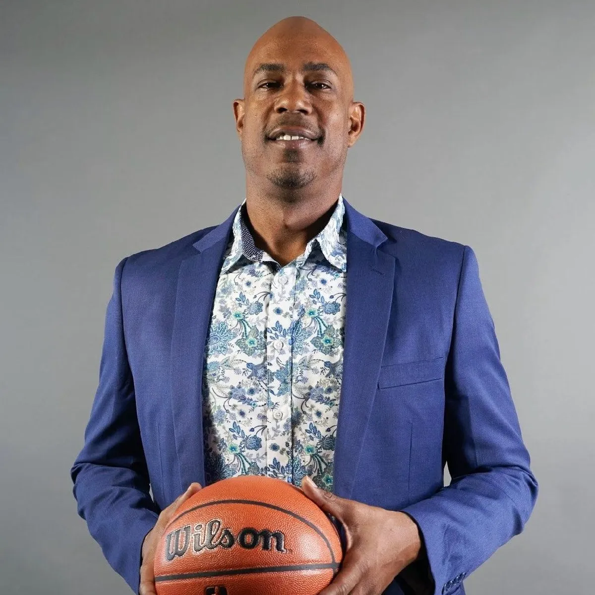 Marlon Minifee, featured guest speaker, holding a basketball